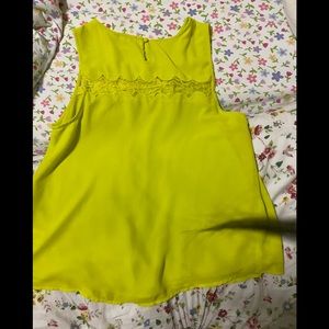 This is a light green shirt by naked zebra size L